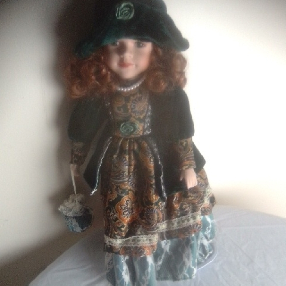 Elegant Green and Blue Porcelain Doll